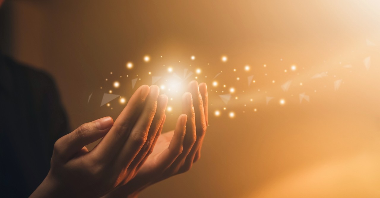 Lights around cupped hands