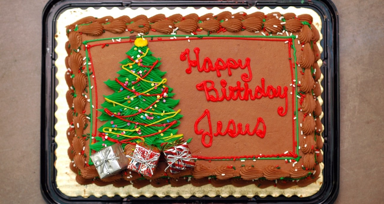 Happy Birthday Jesus written on cake with Christmas tree icing