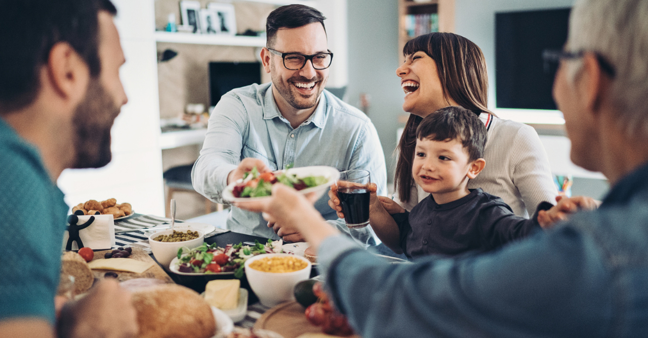 Family sharing a meal around a dining table
